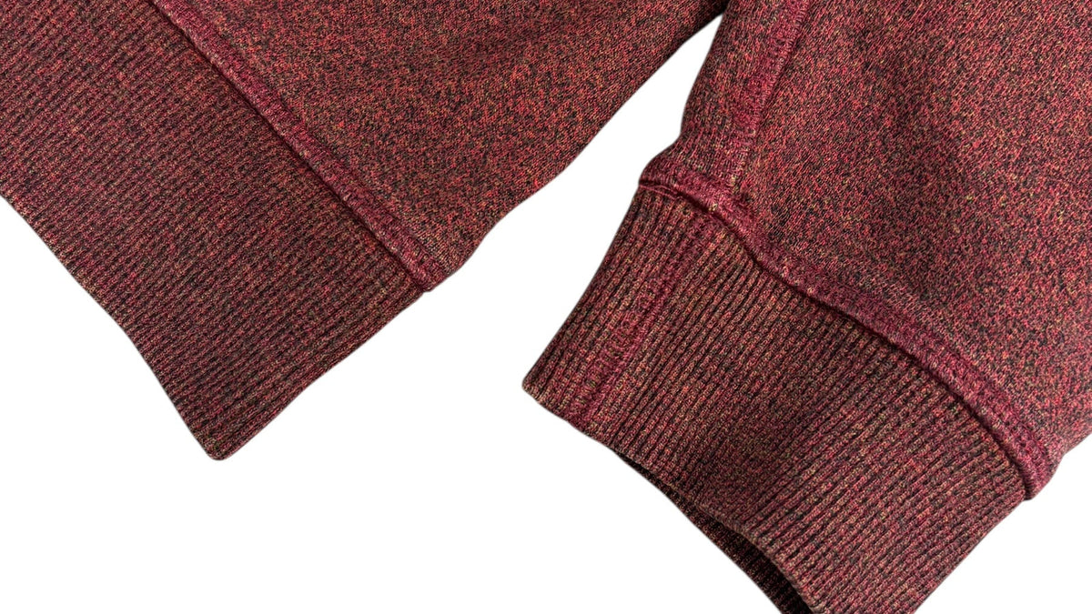 Détail d'un pull Kenzo bordeaux authentifié chez NB08, repère de finition