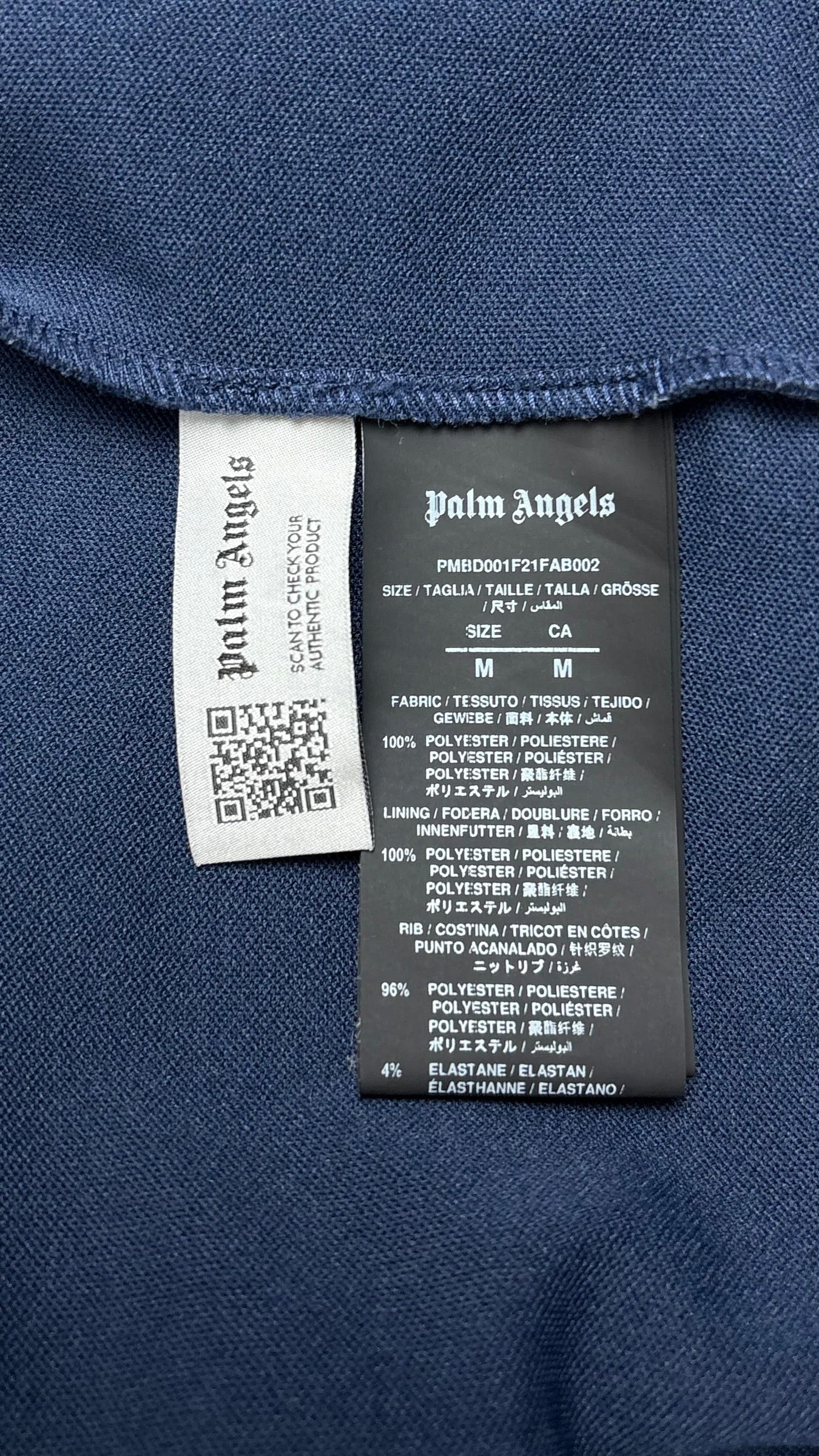 Étiquette intérieure de la veste Palm Angels indiquant la taille M, la composition et un code QR d'authenticité